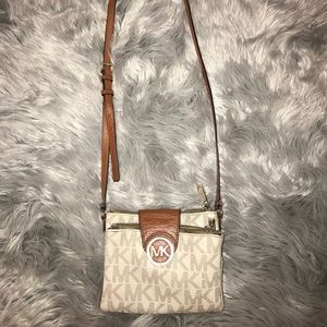 Authentic Micheal Kors cross body bag.